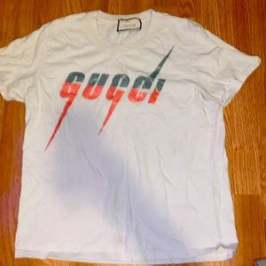 Gucci shirt size small a few stains but not noticeable.
